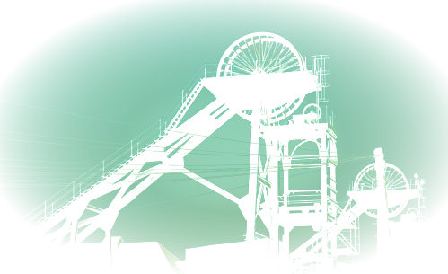 Winding gear at a disused mine juts up into the sky.