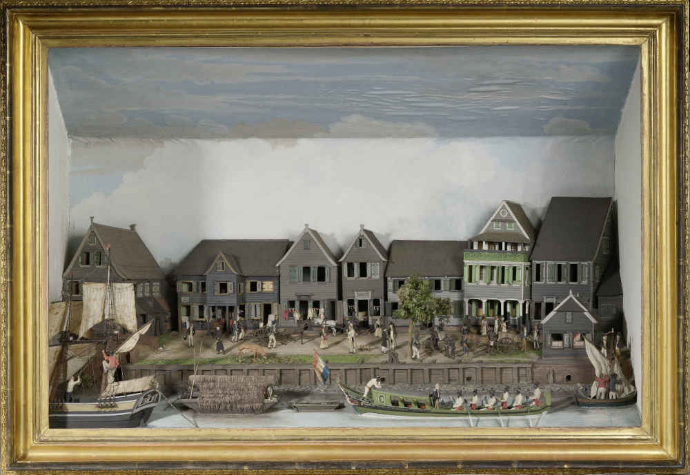 A charming diorama of a colonial waterfront