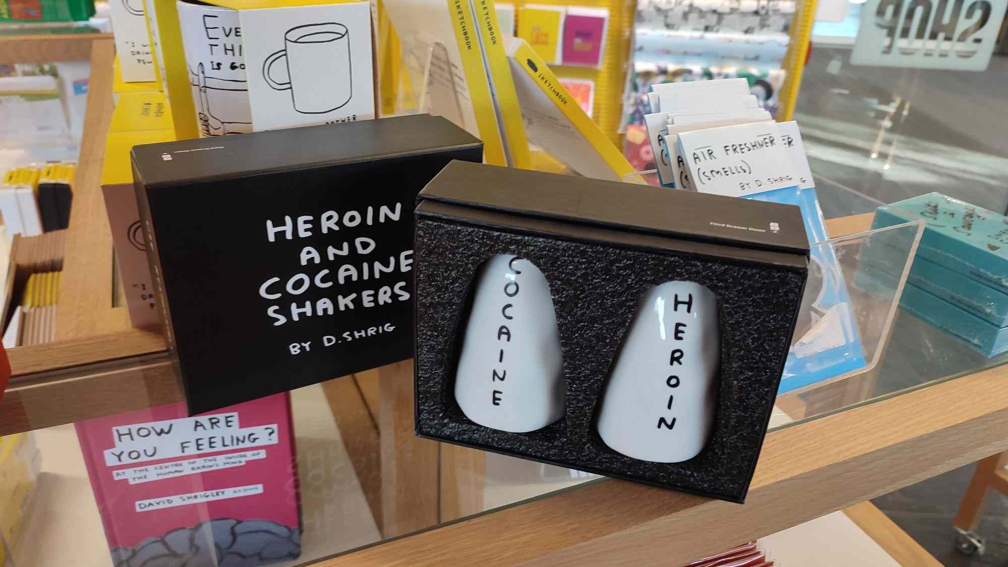 A pair of salt and pepper shakers labelled "cocaine" and "heroin" for sale in a museum gift shop