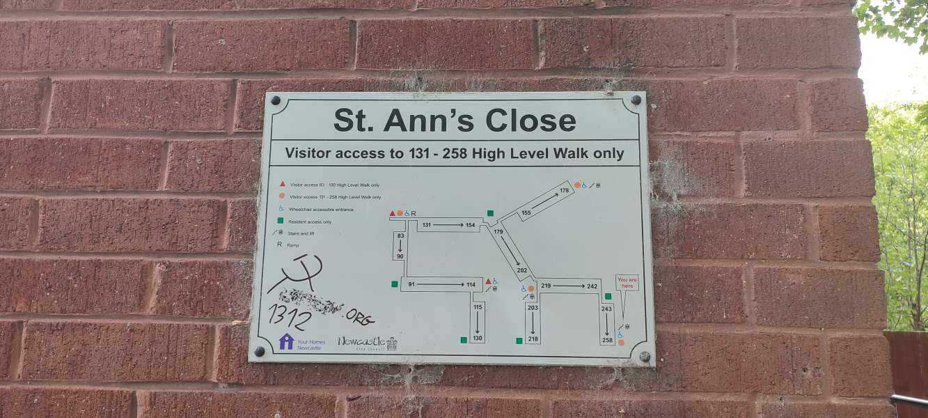A diagram of the flat of St Ann’s Close has been vandalised with a hammer and sickle, a blurred-out website link, and “1312”.