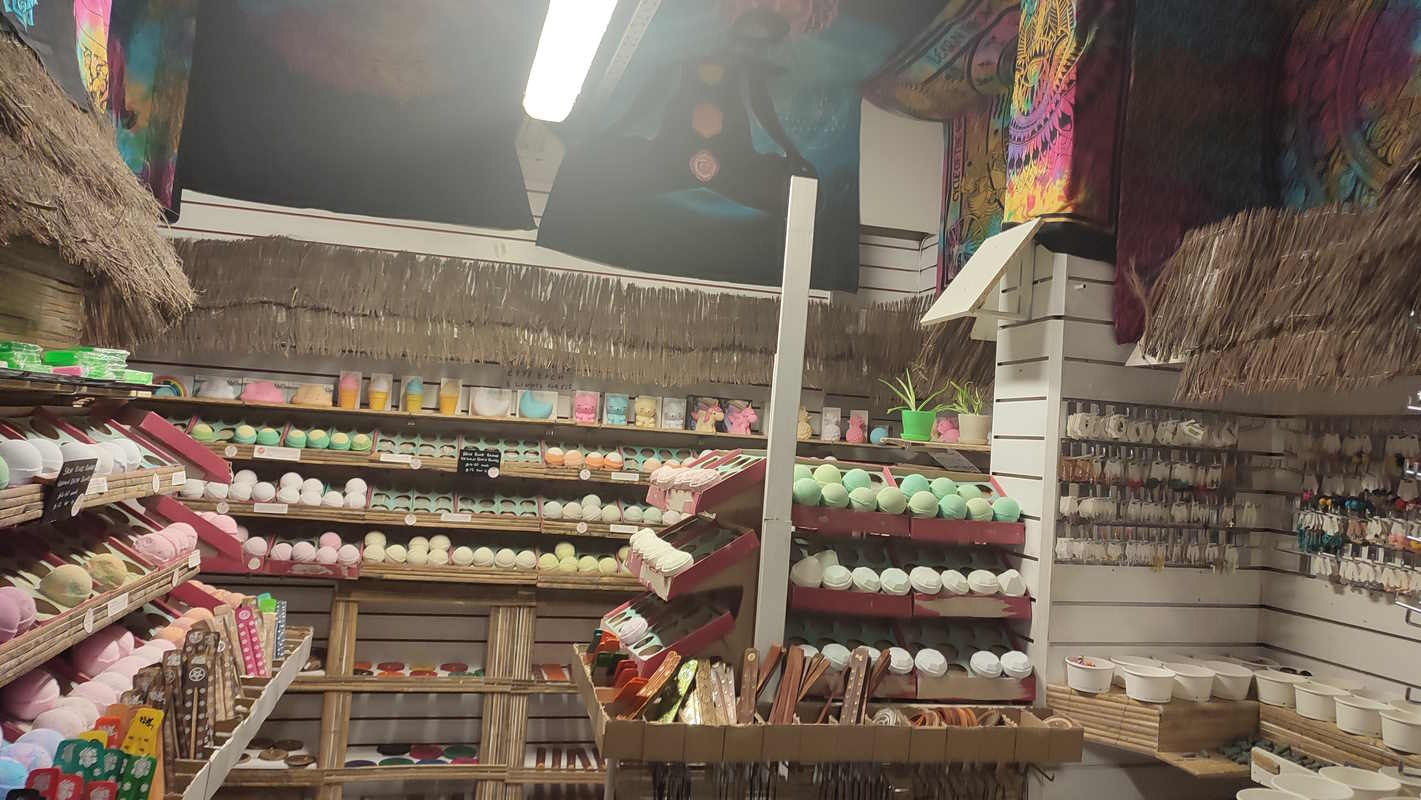 A bath bomb store covered in bamboo  and tie-dye cloth
