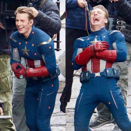 Chris Evans, in costume as Captain America, laughs hysterically.