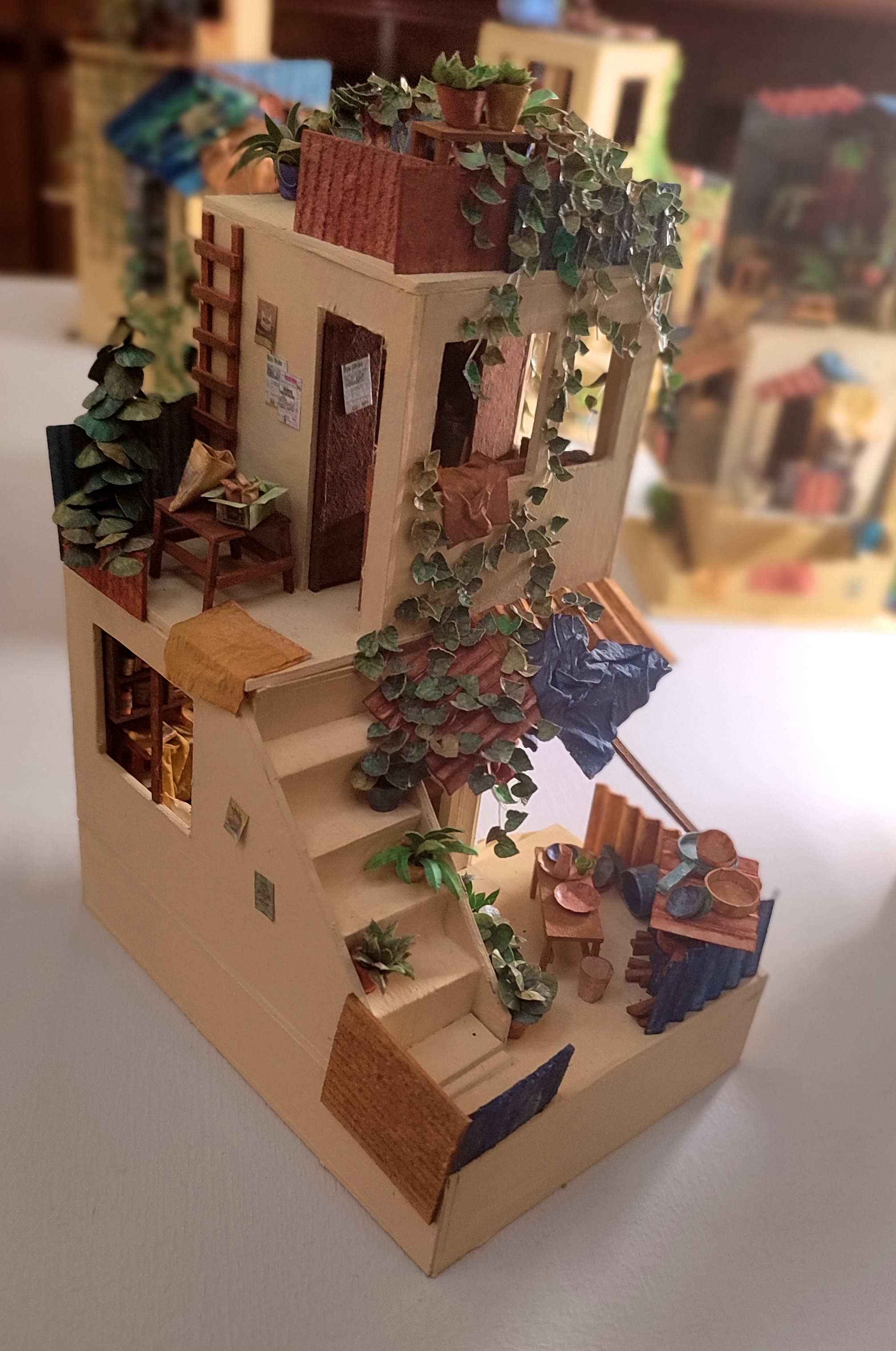 A tiny, Middle Eastern-style cardboard house