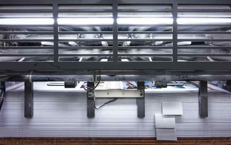 Paper streams through a printing press