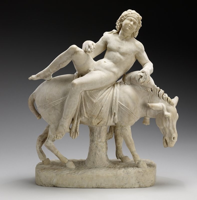 Dionysos riding on the back of a mule.